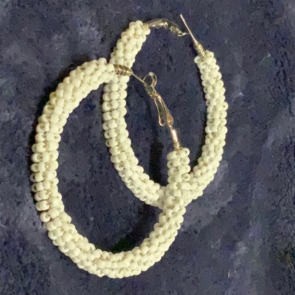 Earrings. Pierced.3.5” round white beaded hoops.